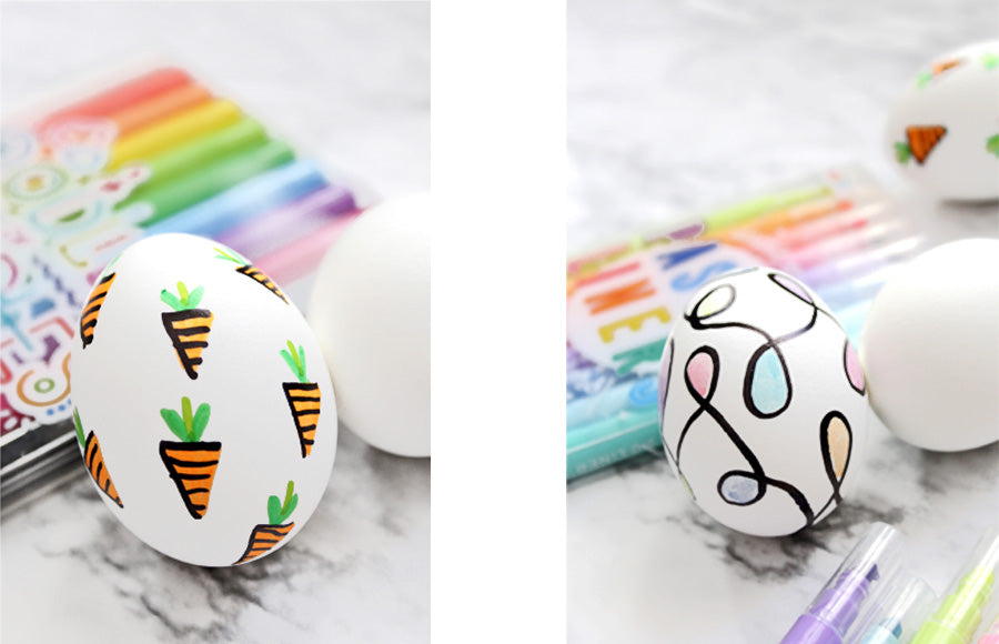 Two decorated Easter eggs with OOLY Oodles of Doodles and Pastel Liners markers
