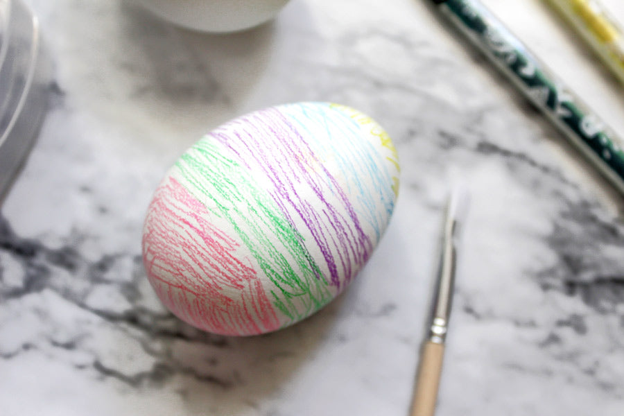 Closeup of colored Easter egg with colored pencil