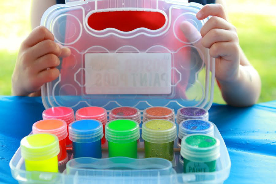 Kid opening set of Glitter and Neon lil Poster Paint Pods