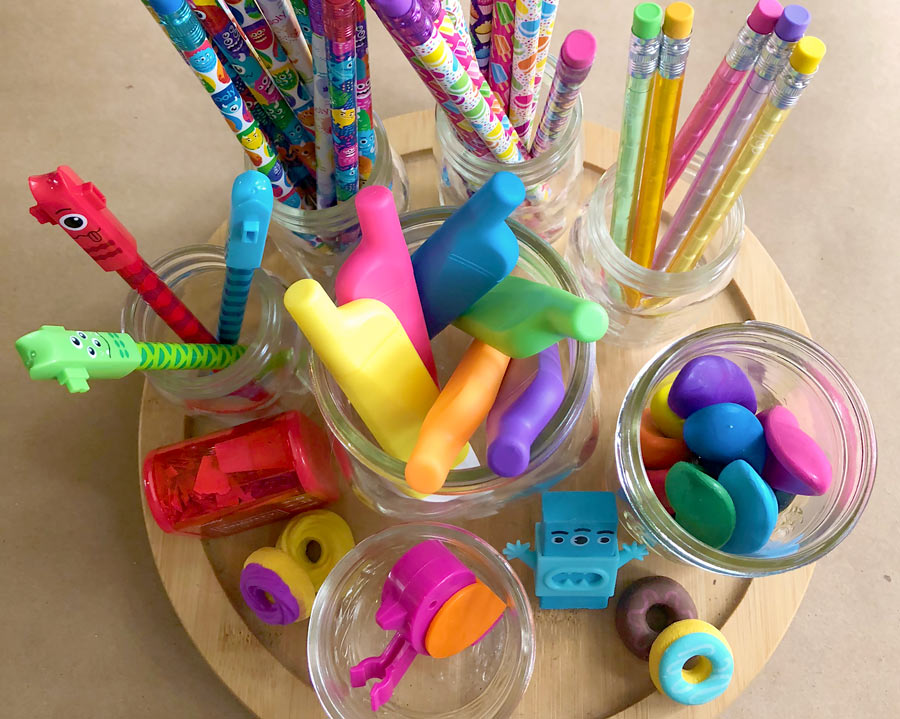 OOLY back to school products in jars including erasers, highlighters, crayons, pencils and pens