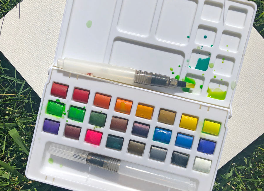 Closeup of Chroma Blends Watercolor Travel Palette on grass