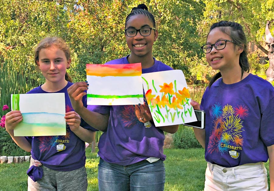 Girls showing their watercolor paintings made with Chroma Blends watercolors