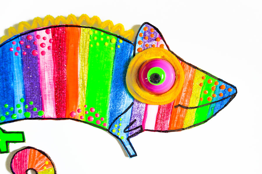 Face of finished, colored chameleon printable craft with 3D paint