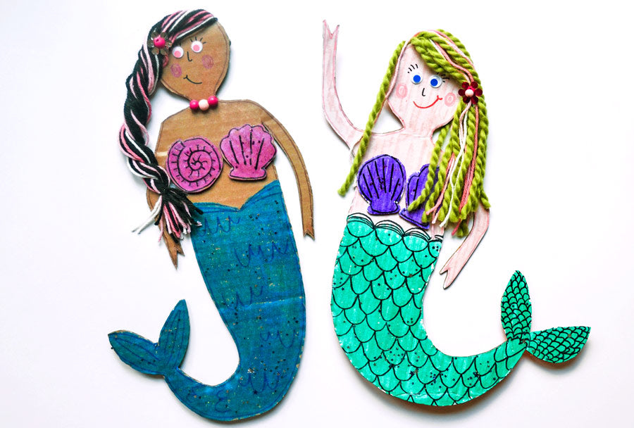 2 completed mermaid craft cutouts made with cardboard