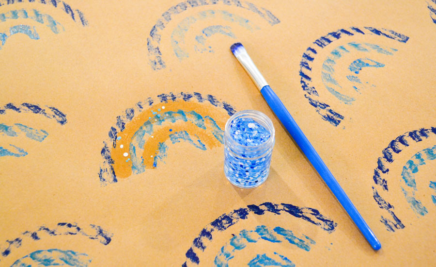 decorate gift wrap with glitter glue