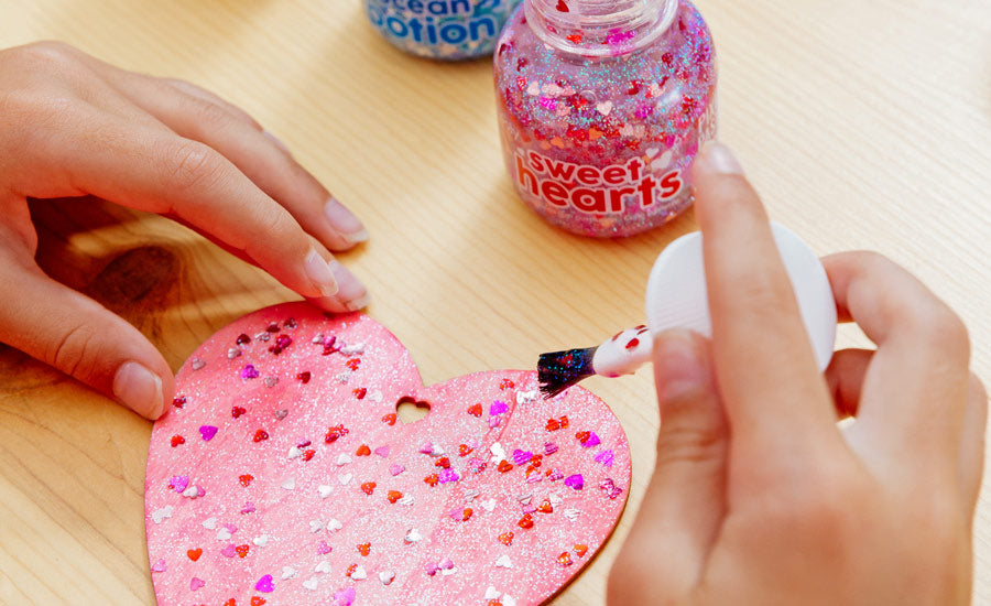 Adding pixie paste sweet hearts to the valentine's day art project