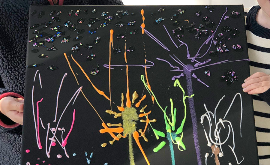 kids displaying their completed dazzling fireworks scene 