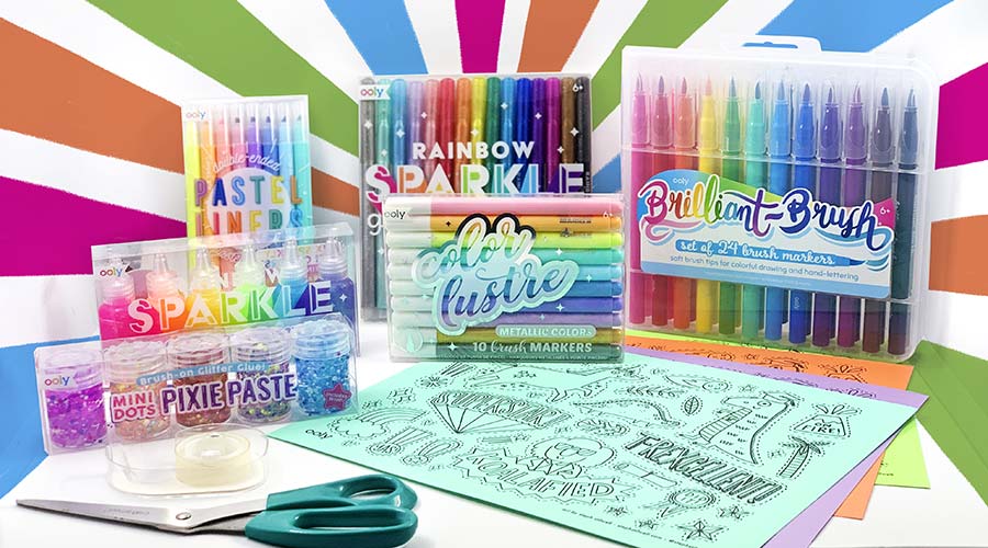 markers, printables and scissors on a colorful background