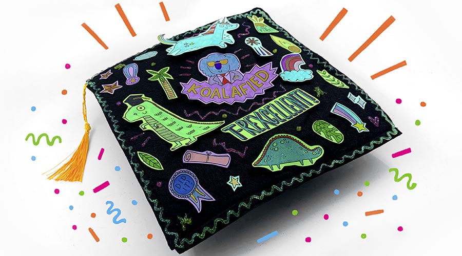 decorated graduation cap on white background with colorful doodles