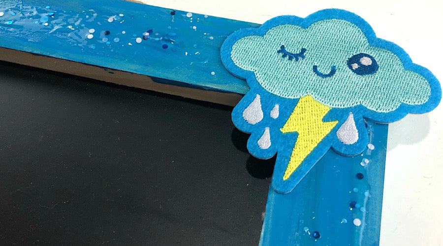 cloud patch on the corner of glitter blue frame