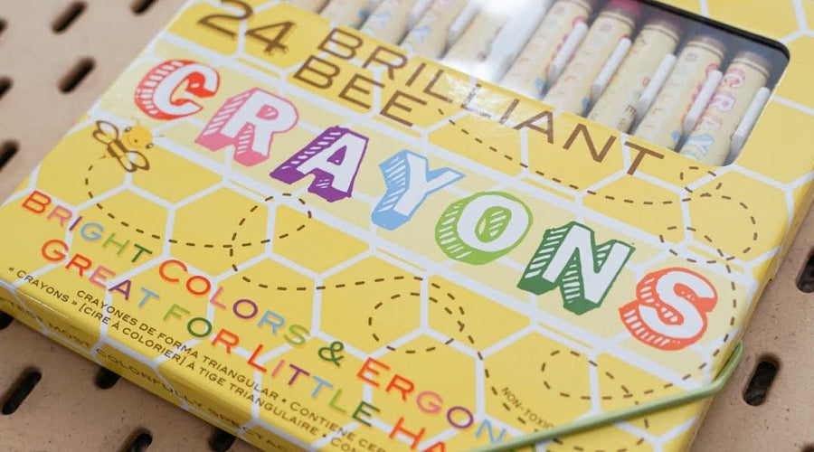 brilliant bee crayons on brown background