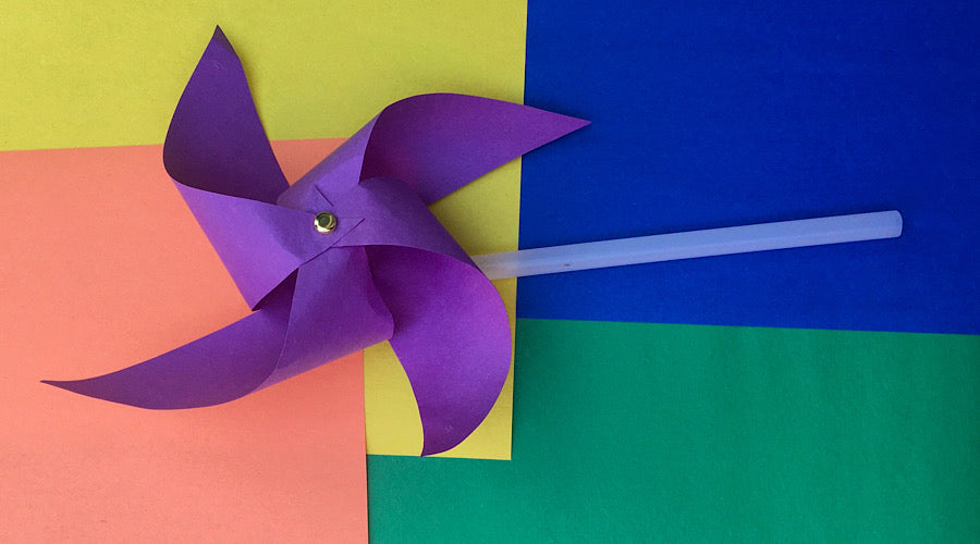 purple pinwheel on colorful background