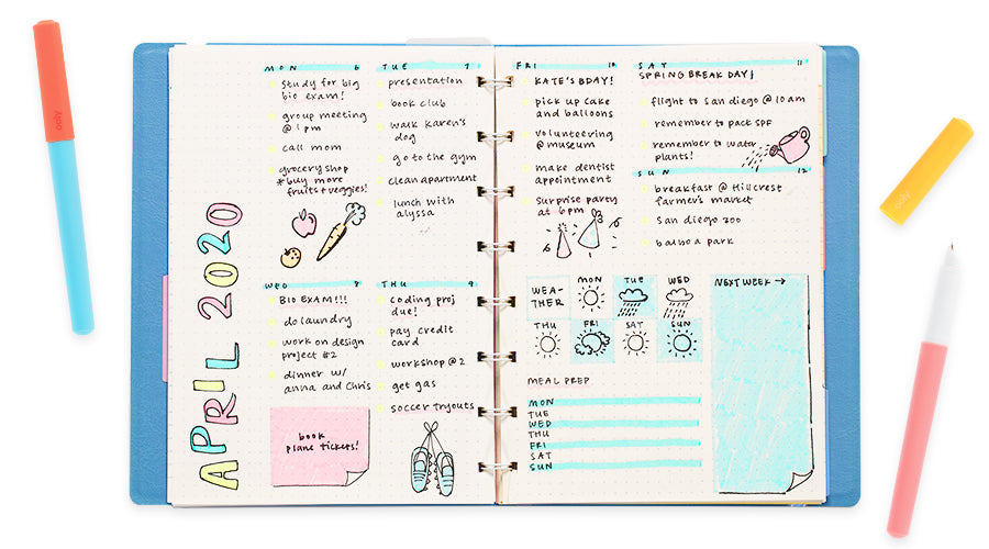 fountain pens next to april 2020 planner pages