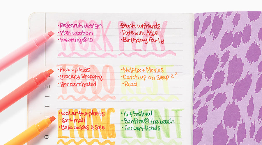 pastel highlighters next to planner page