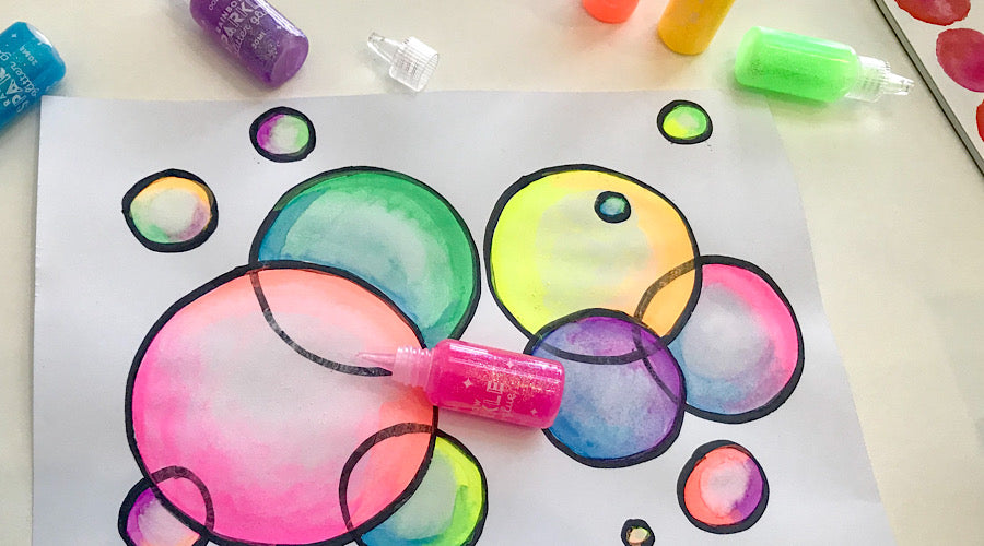 colorful bubbles on white paper with glitter glue 