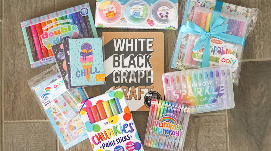 colorful school supplies on wooden surface