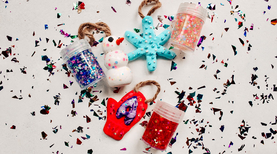 air dry clay ornaments with pixie paste glitter glue on white surface with confetti