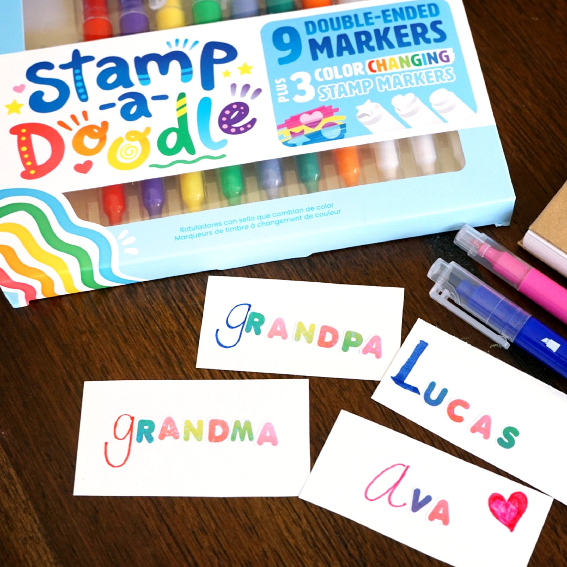 Ooly stamp-a-doodle stamp markers and name cards on a table