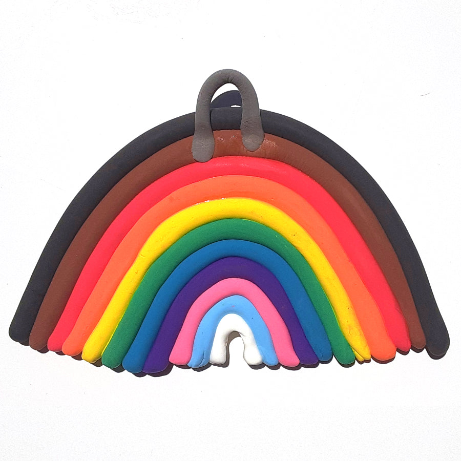 Clay rainbow craft with gray clay hook at the top