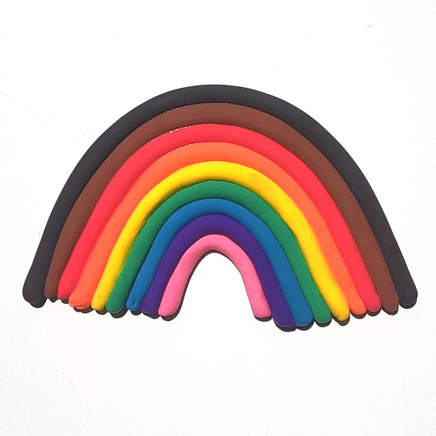 Colorful clay rainbow in pink, purple, blue, green, yellow, orange, red, brown and black