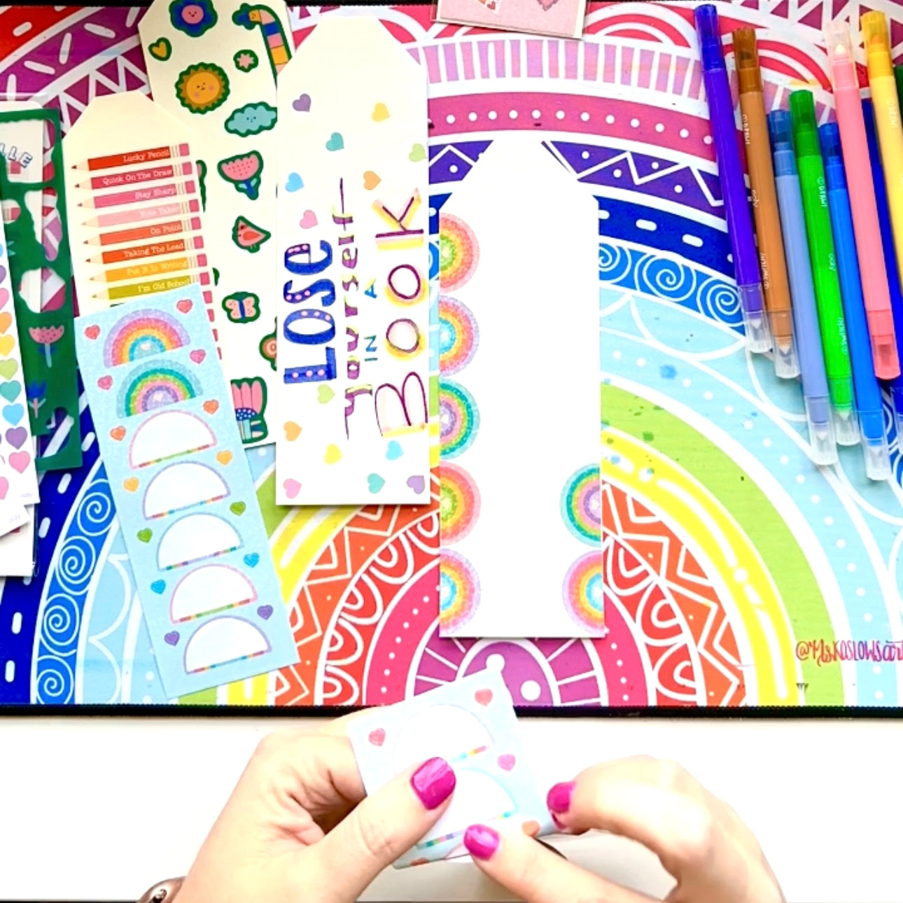 Adding colorful stickers to DIY bookmarks