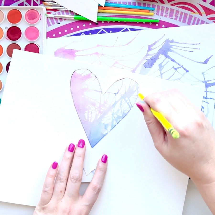 Tracing outline of heart shape with watercolor background